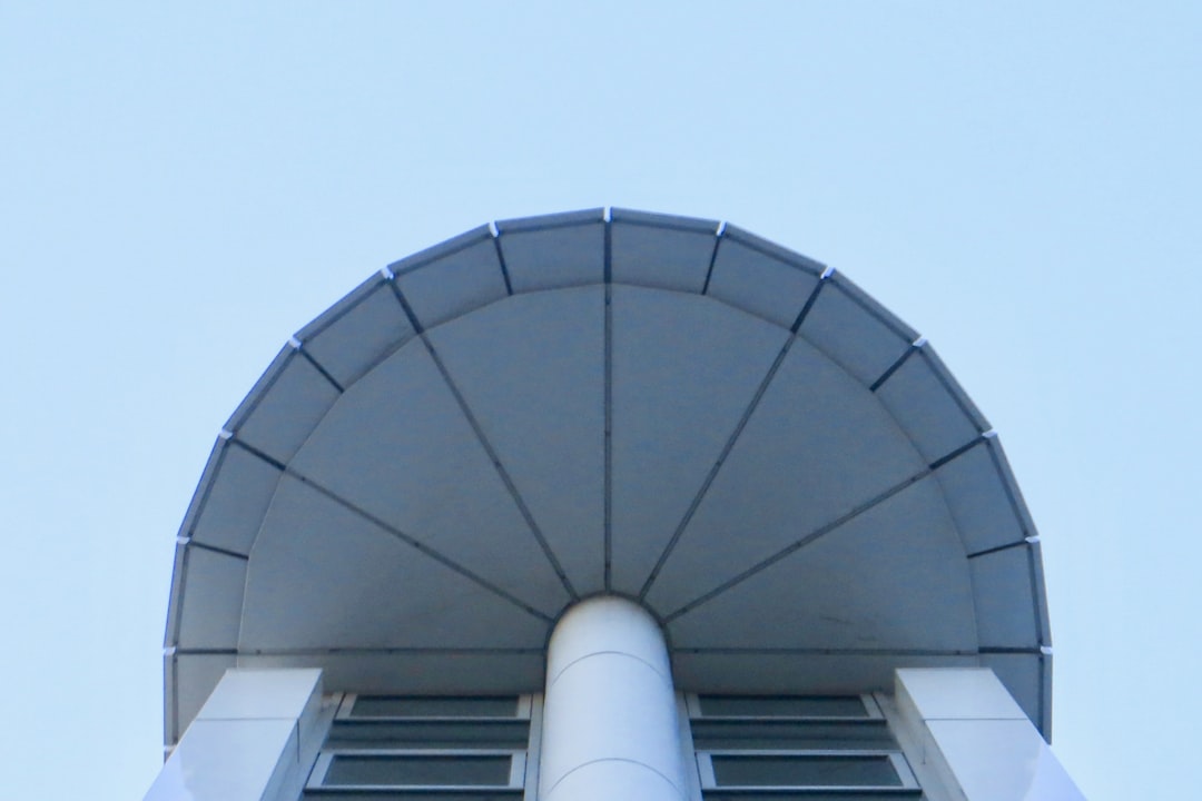 low-angle photograph of white concrete structure