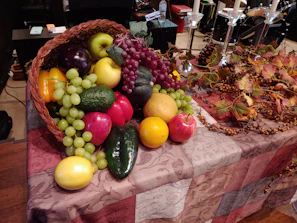 A basket overflowing with colorful seasonal fruits like apples, berries, and peaches.