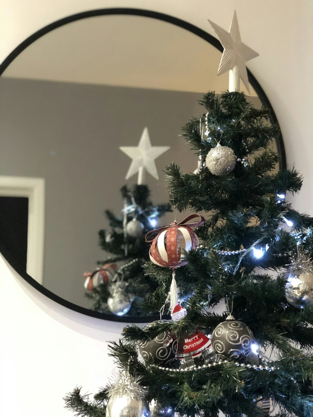 Christmas tree near mirror