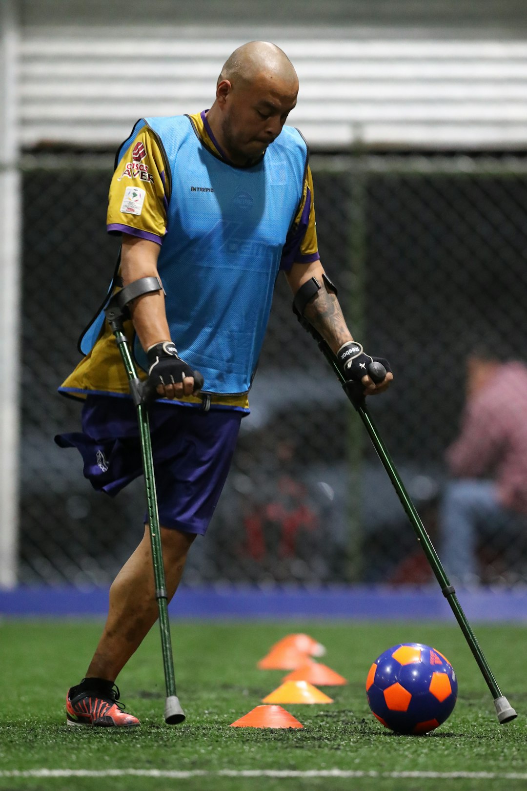 one-legged man playing soccer