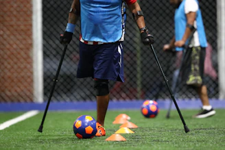 person PWD playing soccer