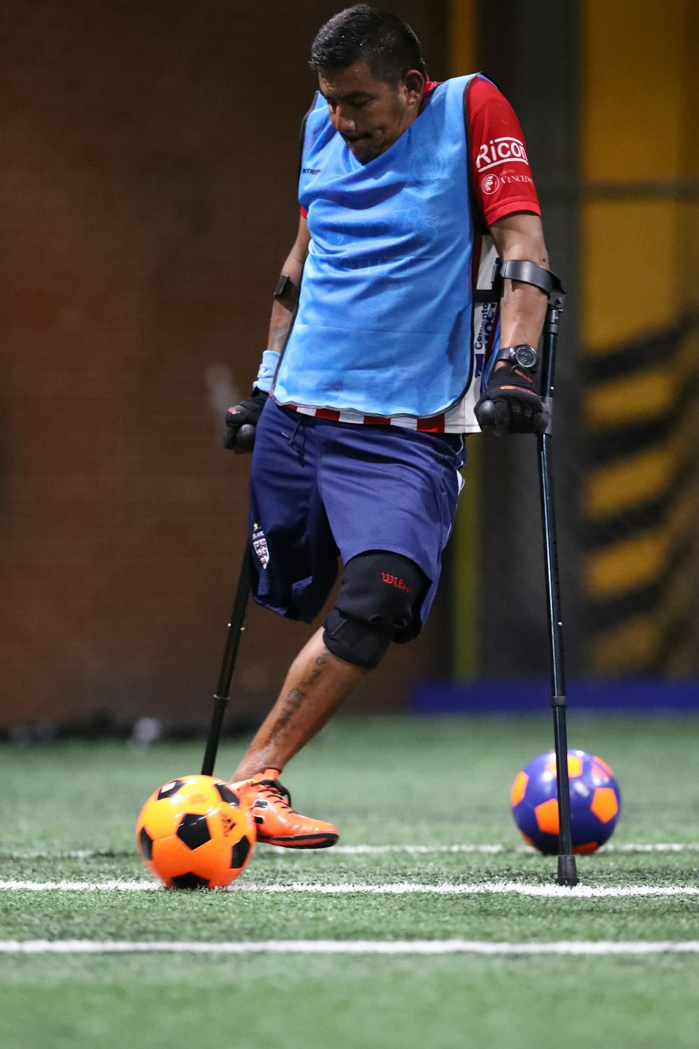 man playing soccer during daytime