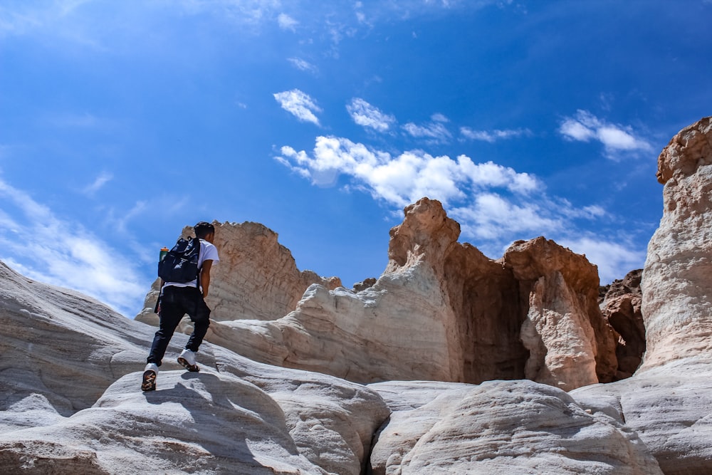 man walking on rocks