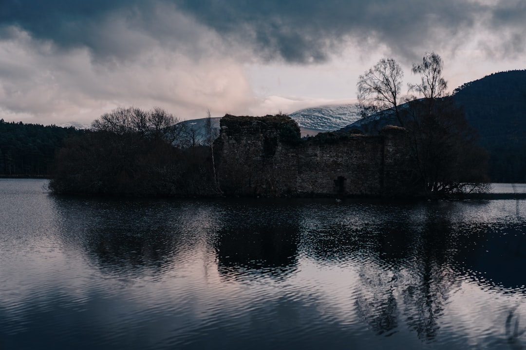 gray concrete building near water