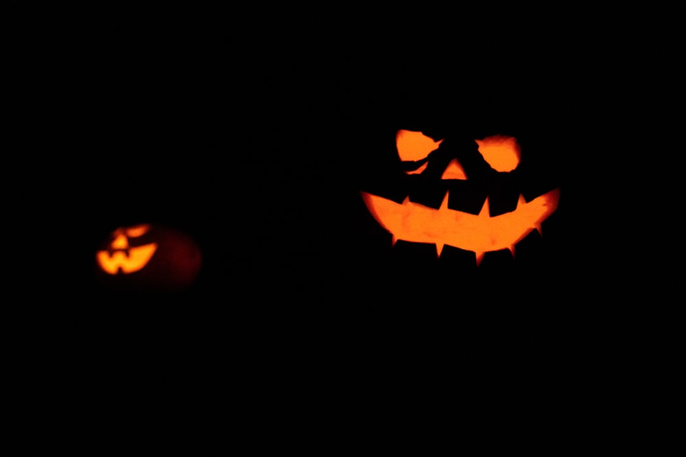 shallow focus photo of lighted Jack O Lanterns