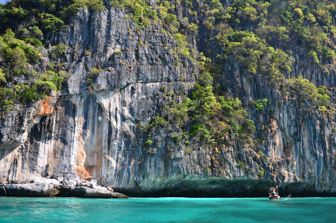 mountain near body of water,