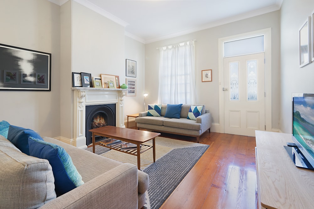 wooden table near sofa in living room