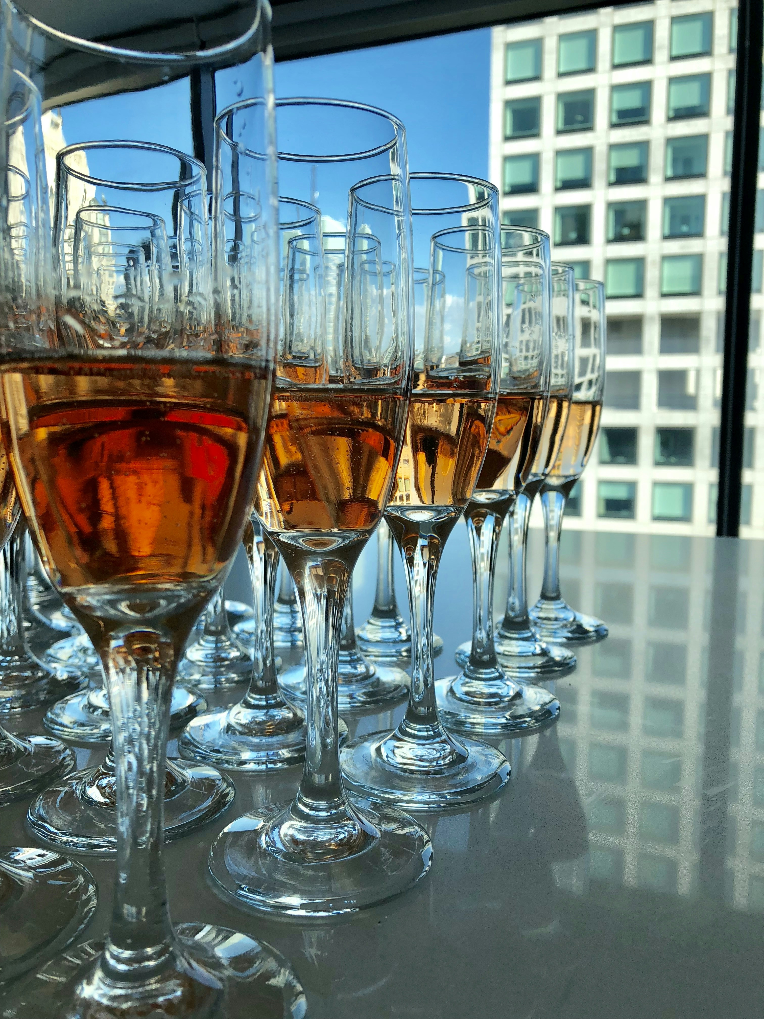 clear flute glasses filled with liquor