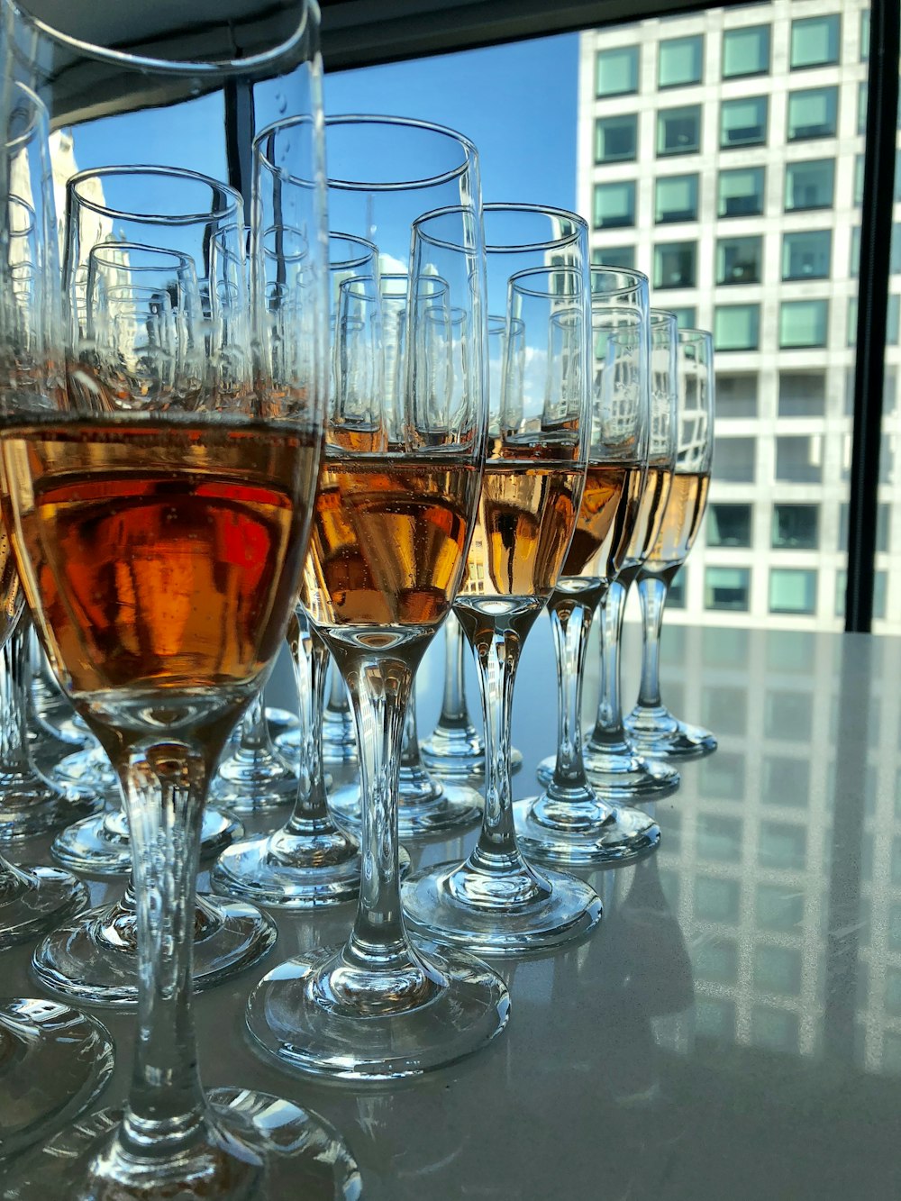 clear flute glasses filled with liquor