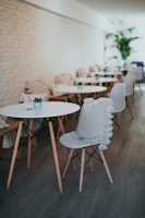 Cozy corner of the café with natural light and minimalist décor.