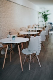 Cozy coffee shop interior with warm brown tones and minimalist decor.