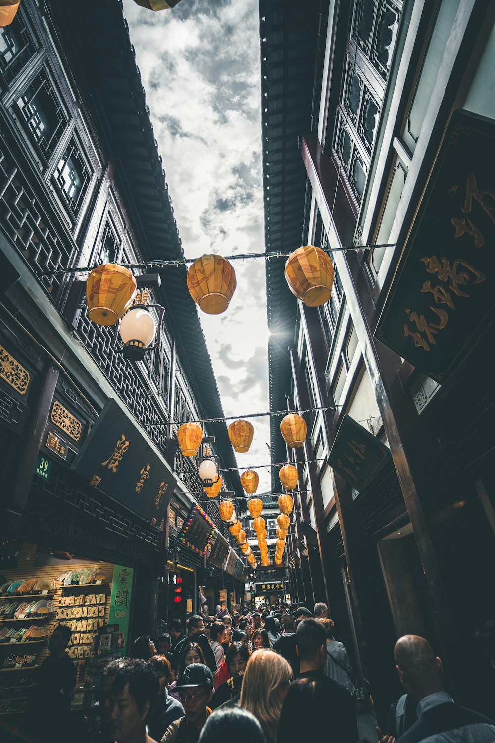 people walking on street between two building