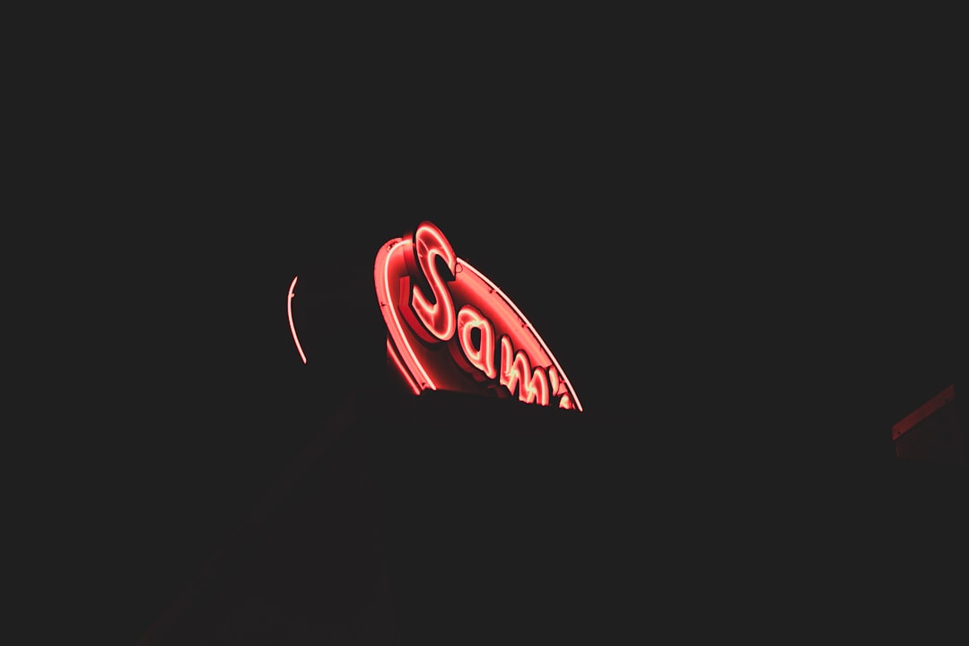 lighted red signage at night