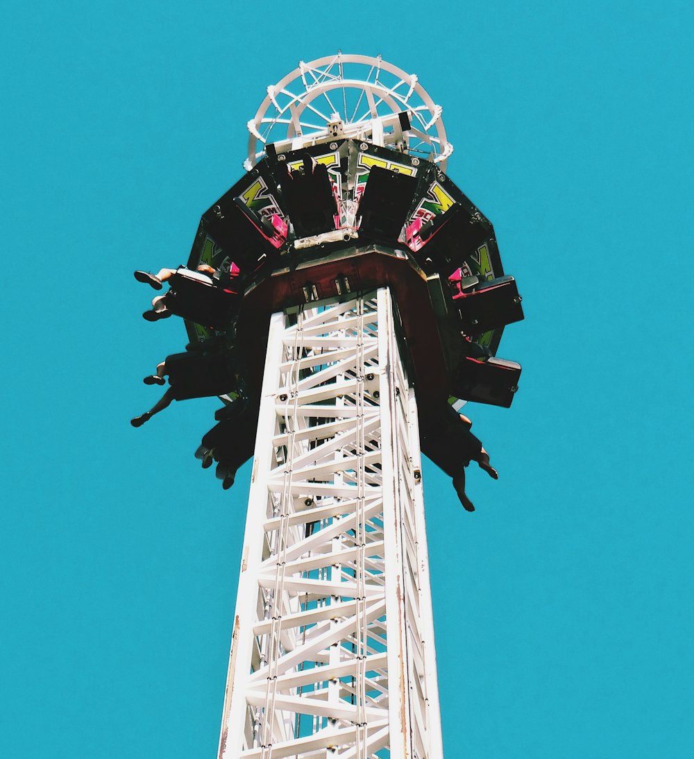 a ferris wheel against a blue sky