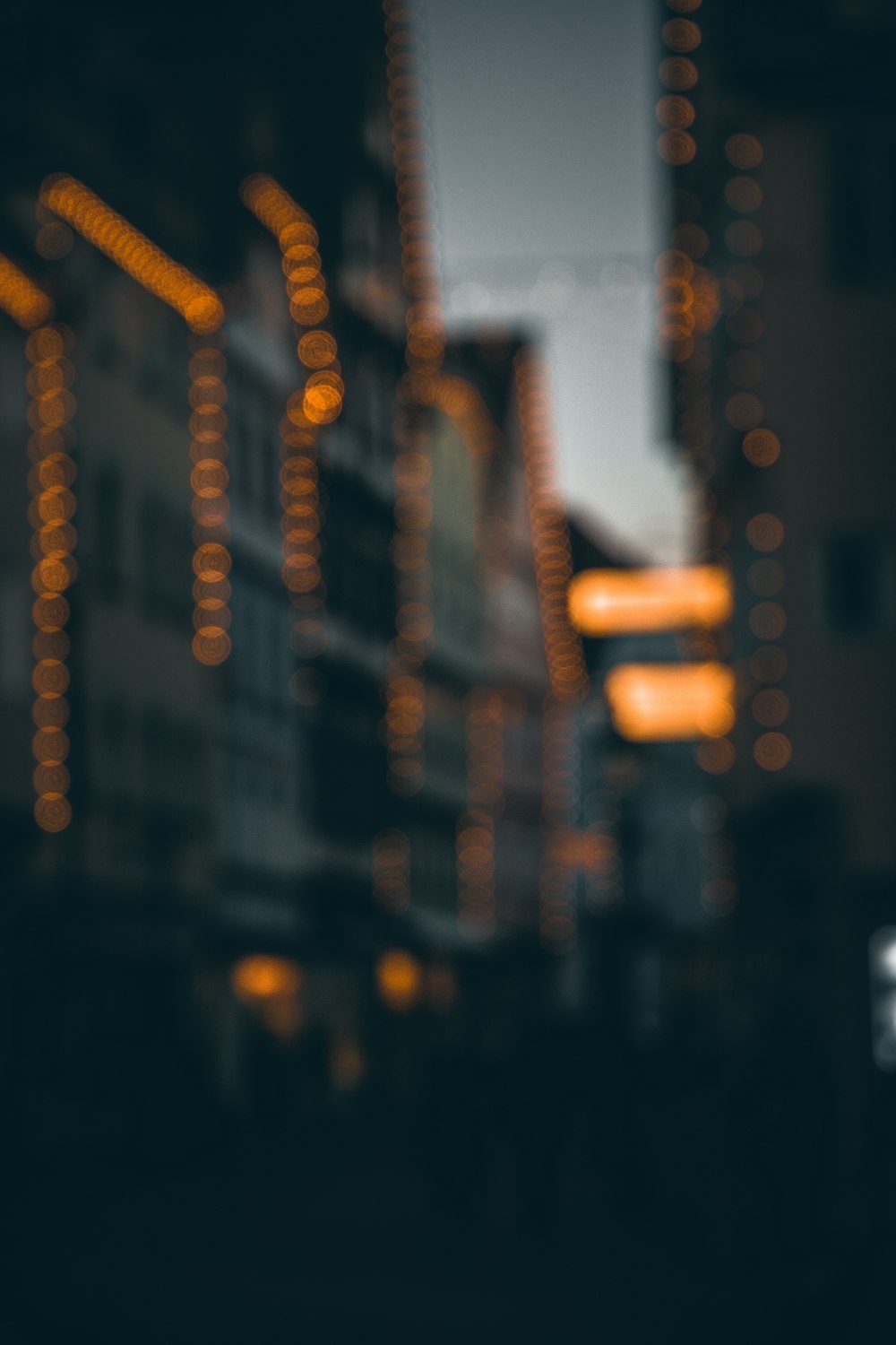 a blurry photo of a city street at night