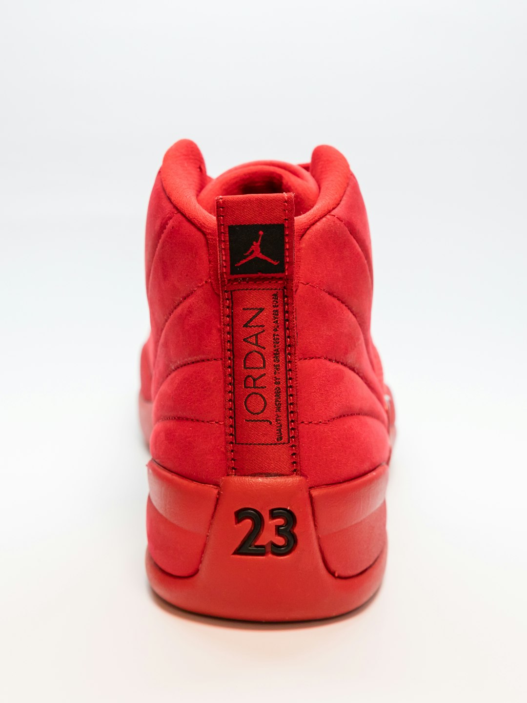 unpaired red Air Jordan basketball shoe