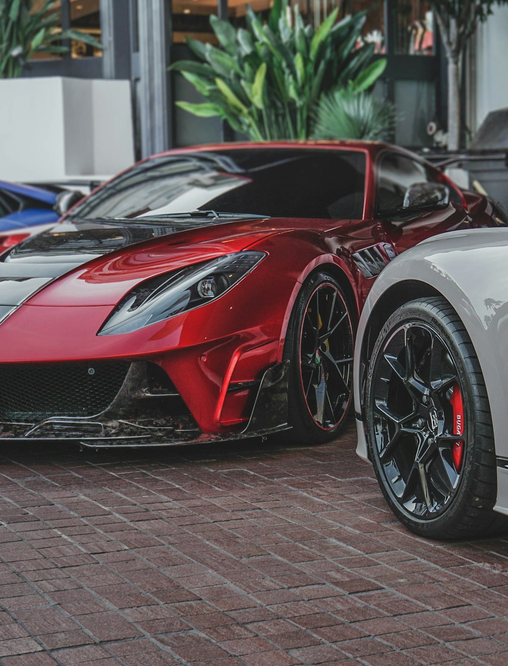 red and black coupe on parked