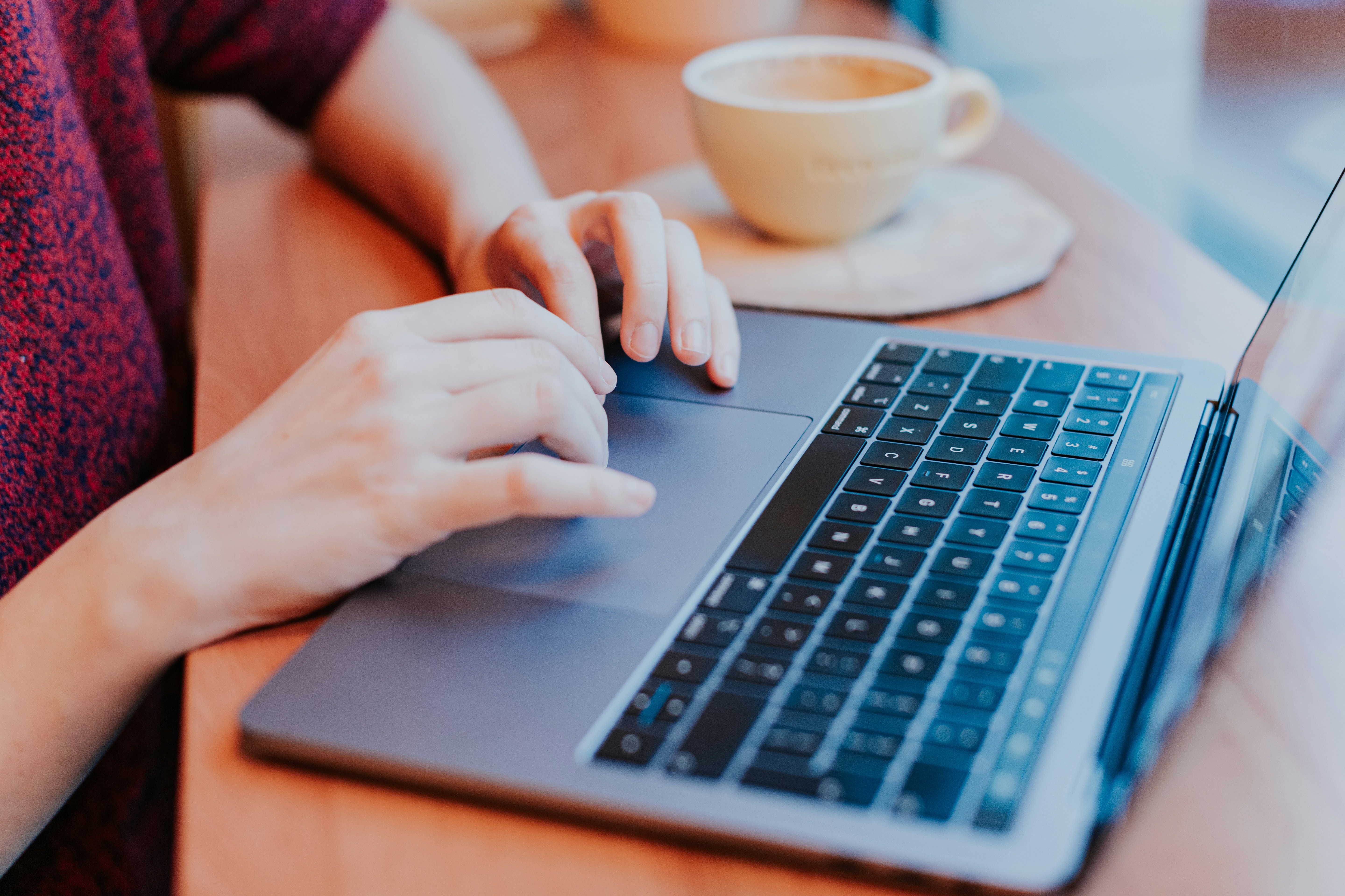 A employee working on her laptop.