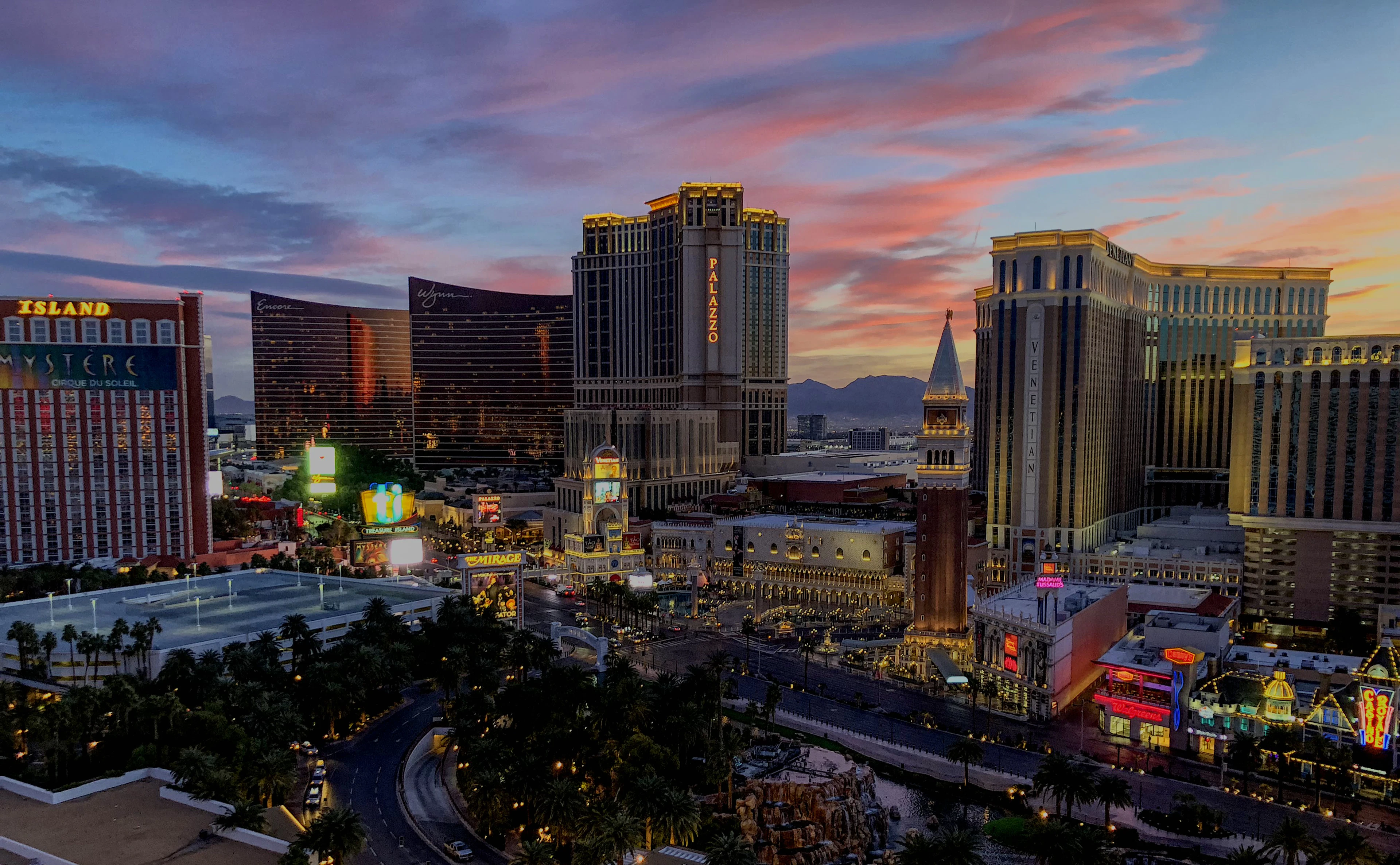 The Las Vegas Strip skyline at dusk, with pastel clouds over the Venetian and Paris hotel towers.