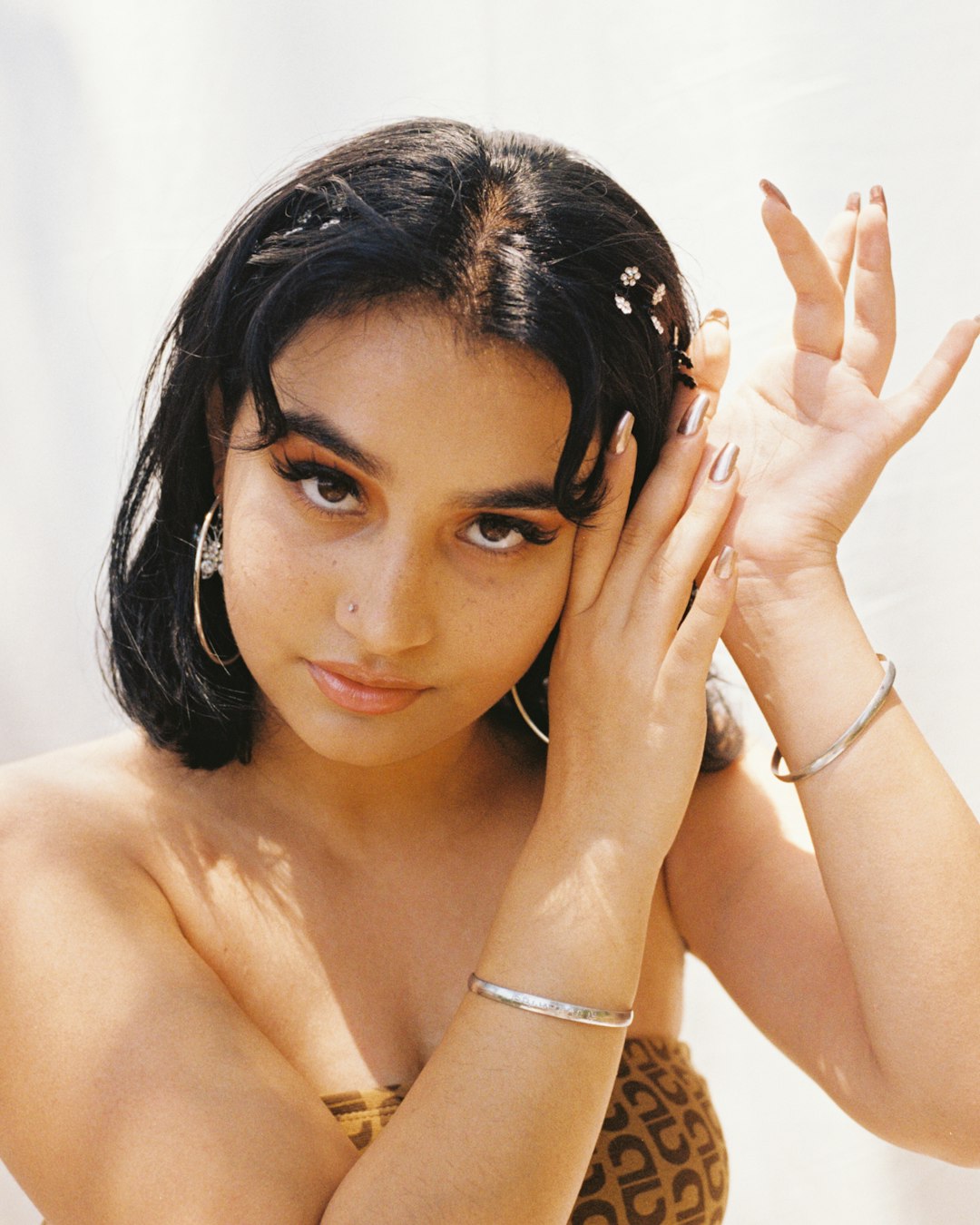 woman wearing orange and brown off-shoulder dress