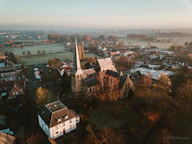 aerial photography of houses on green field during daytime