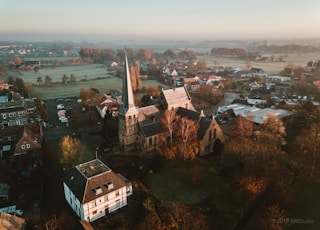 aerial photography of houses on green field during daytime