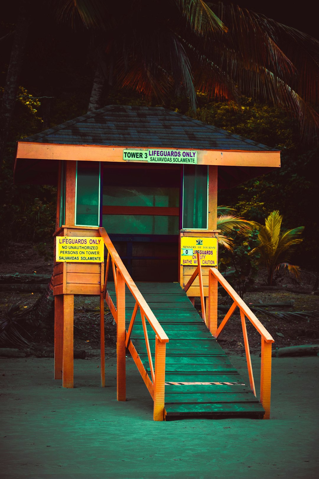 orange and black tower with ramp on sand