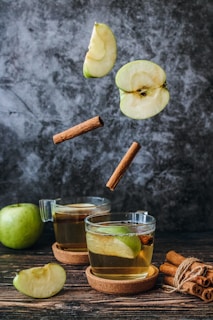 sliced apples on cup with cinamon