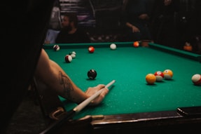 man playing pool