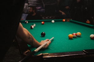 man playing pool