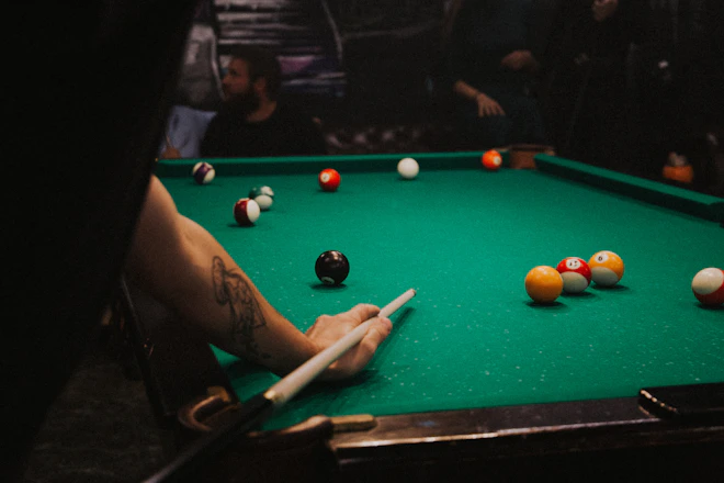 man playing pool