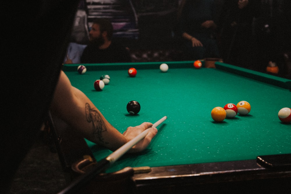 man playing pool