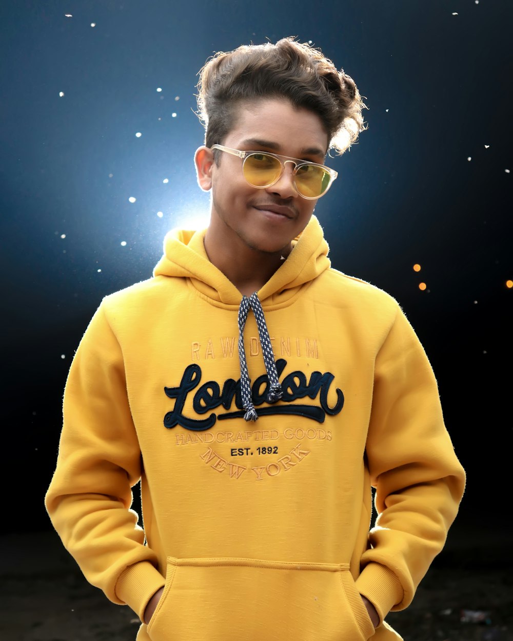 man wearing yellow London-printed pullover hoodie