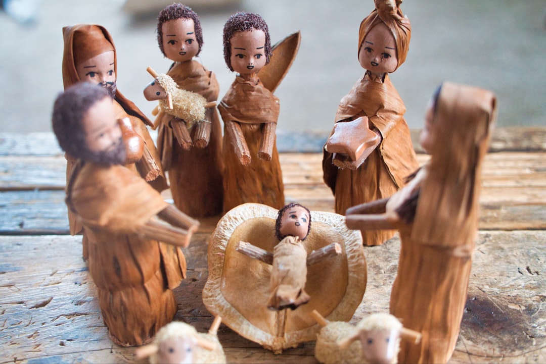 brown wooden nativity of Jesus figurine set on brown surface