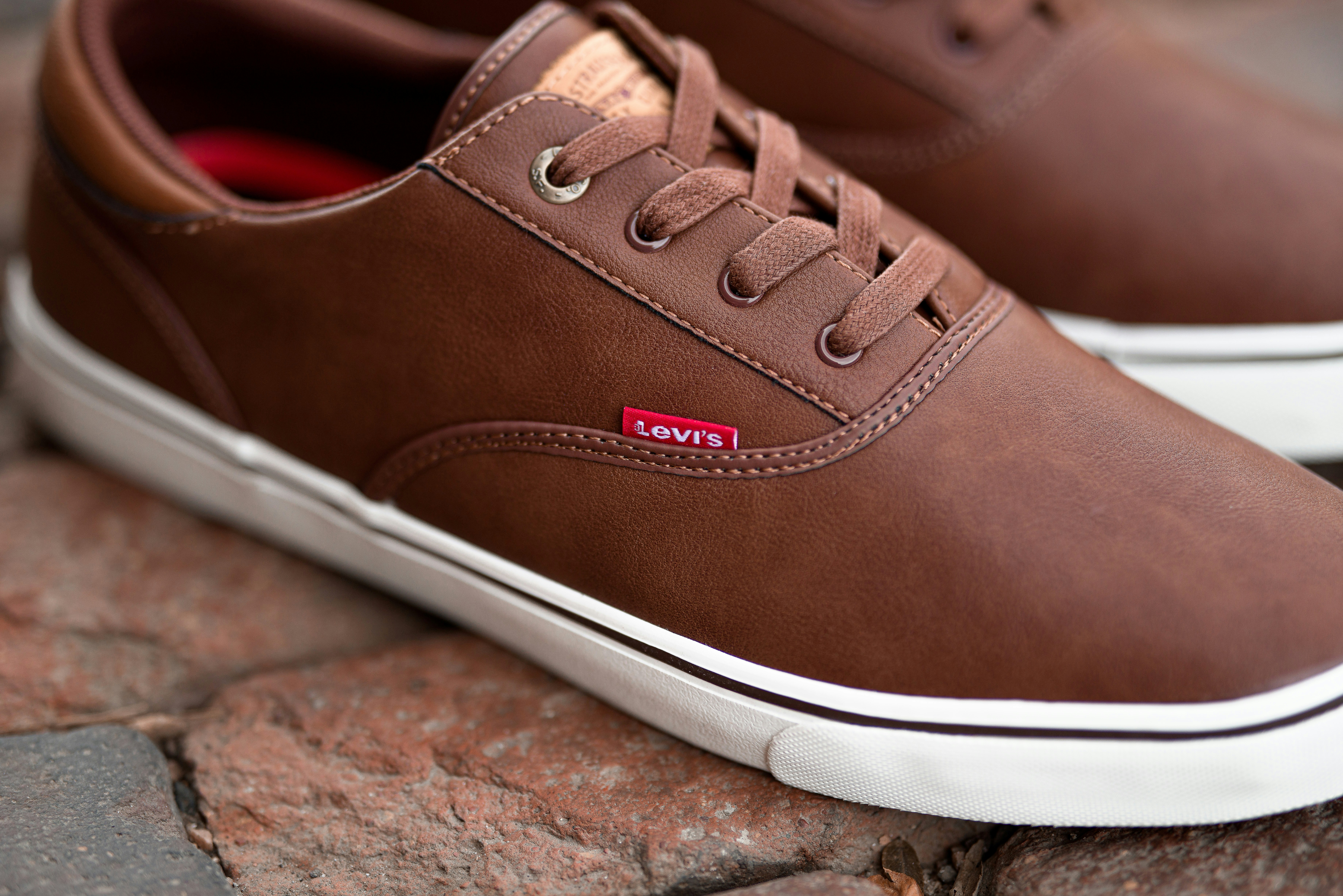 pair of brown Levi's low-top shoes 