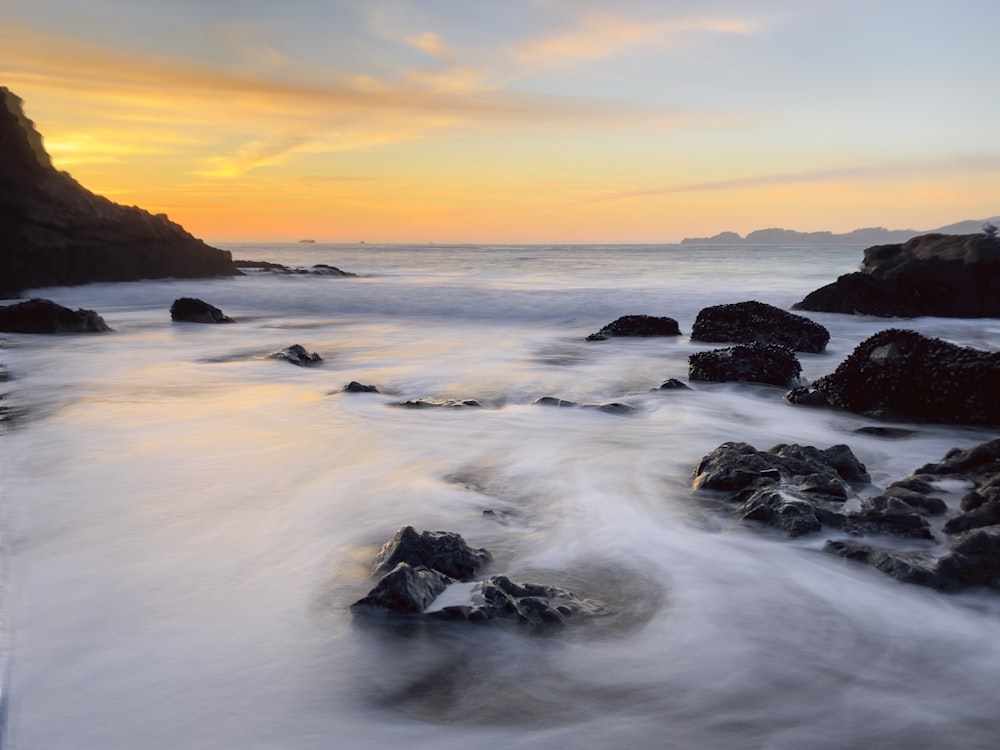 body of water during golden hour