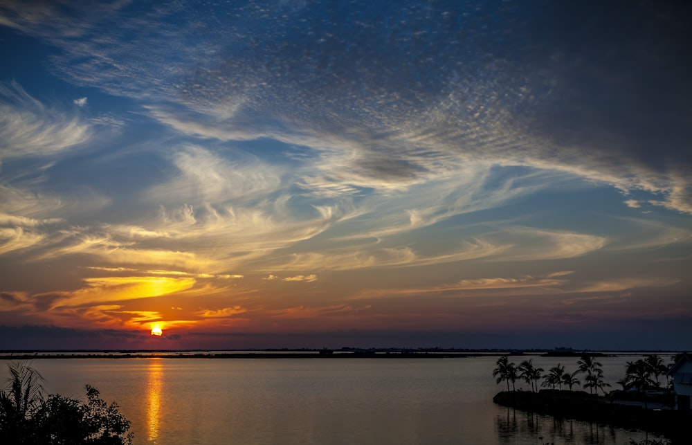 body of water during golden hour