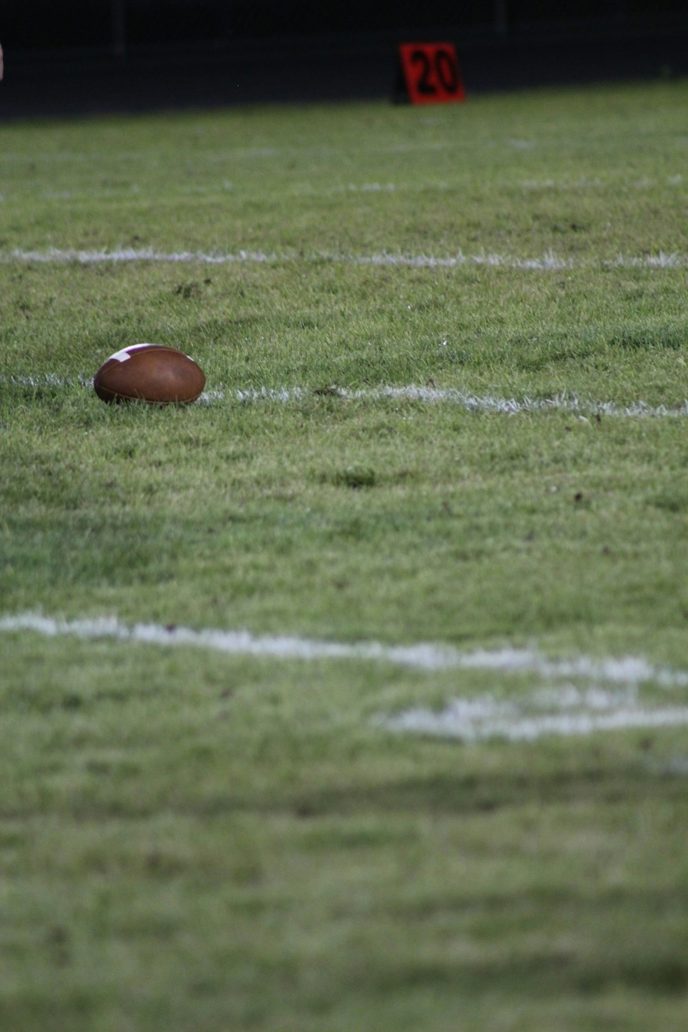 brown football on field