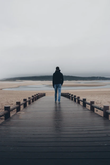 man standing on dock