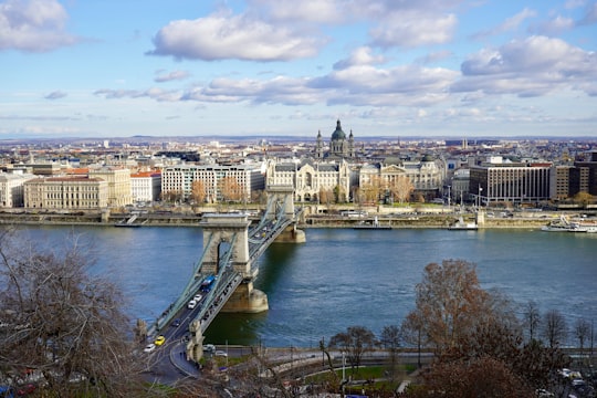 beige and gray concrete bridge scenery in Széchenyi Chain Bridge Hungary