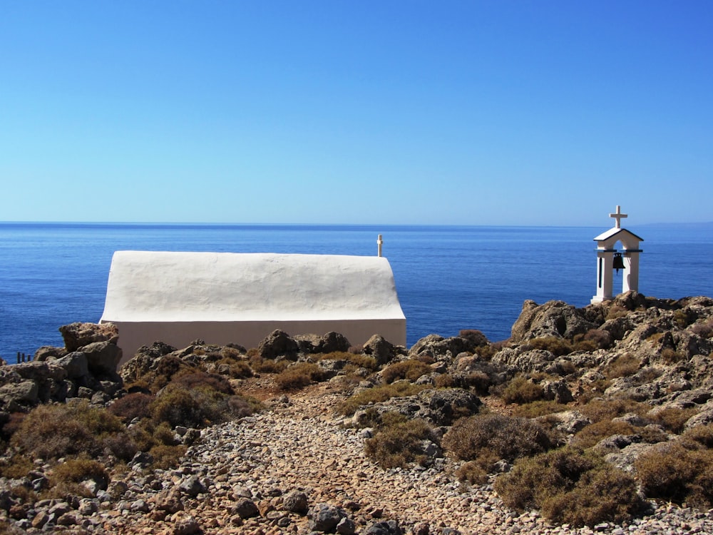 white cathedral beside of seashore