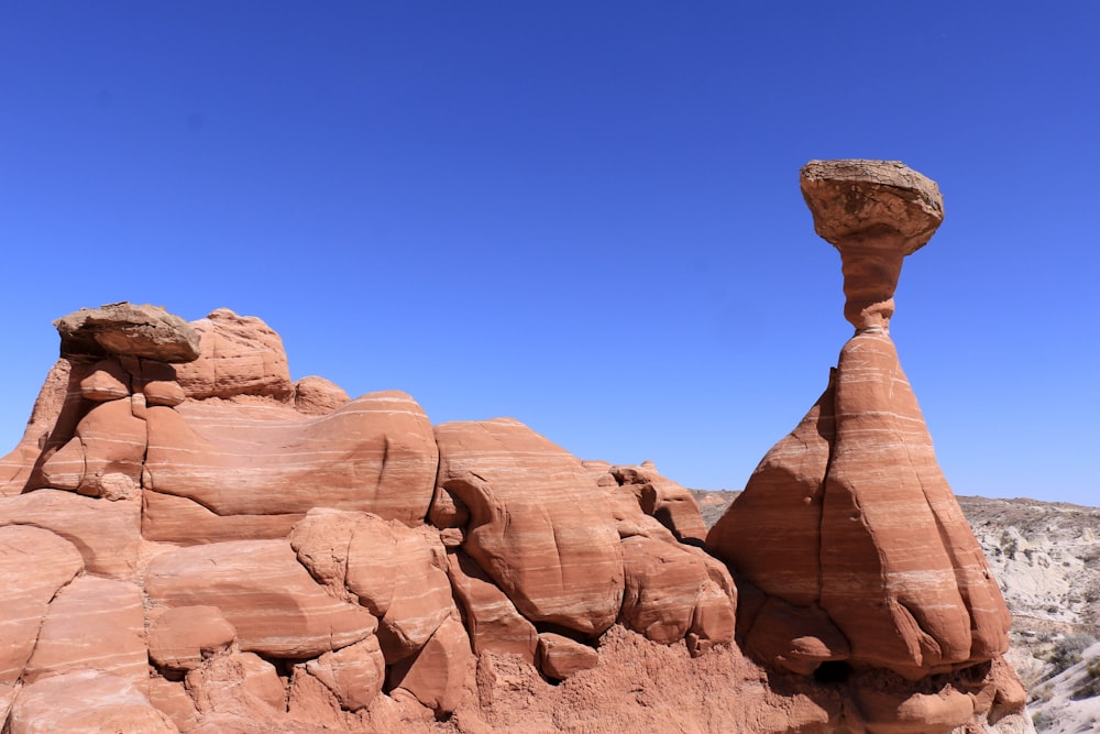 brown rock formation under blue sky during daytime