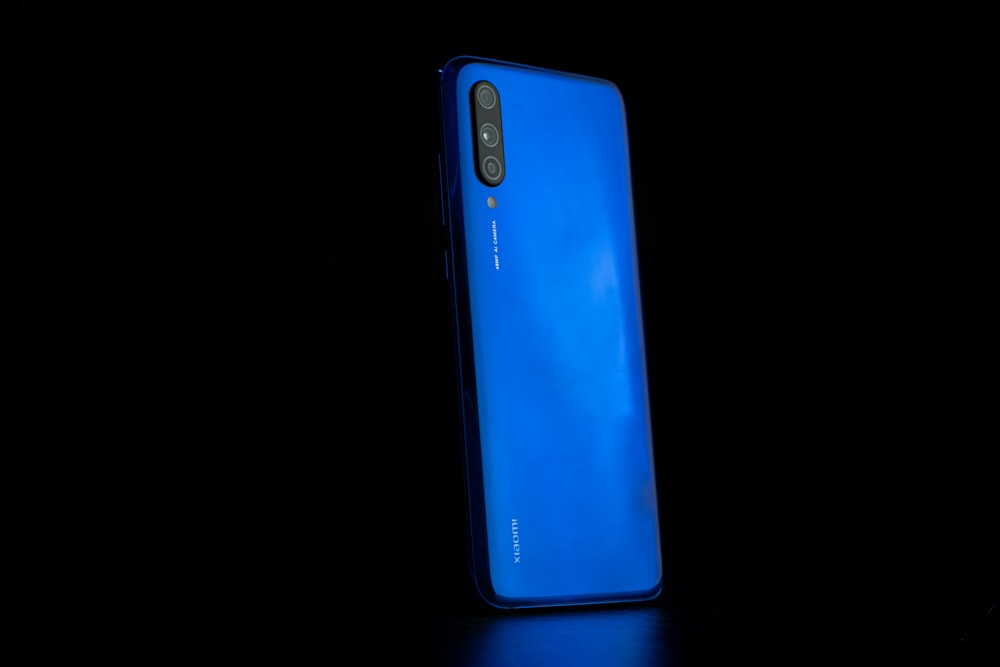 blue and black Xiaomi smartphone