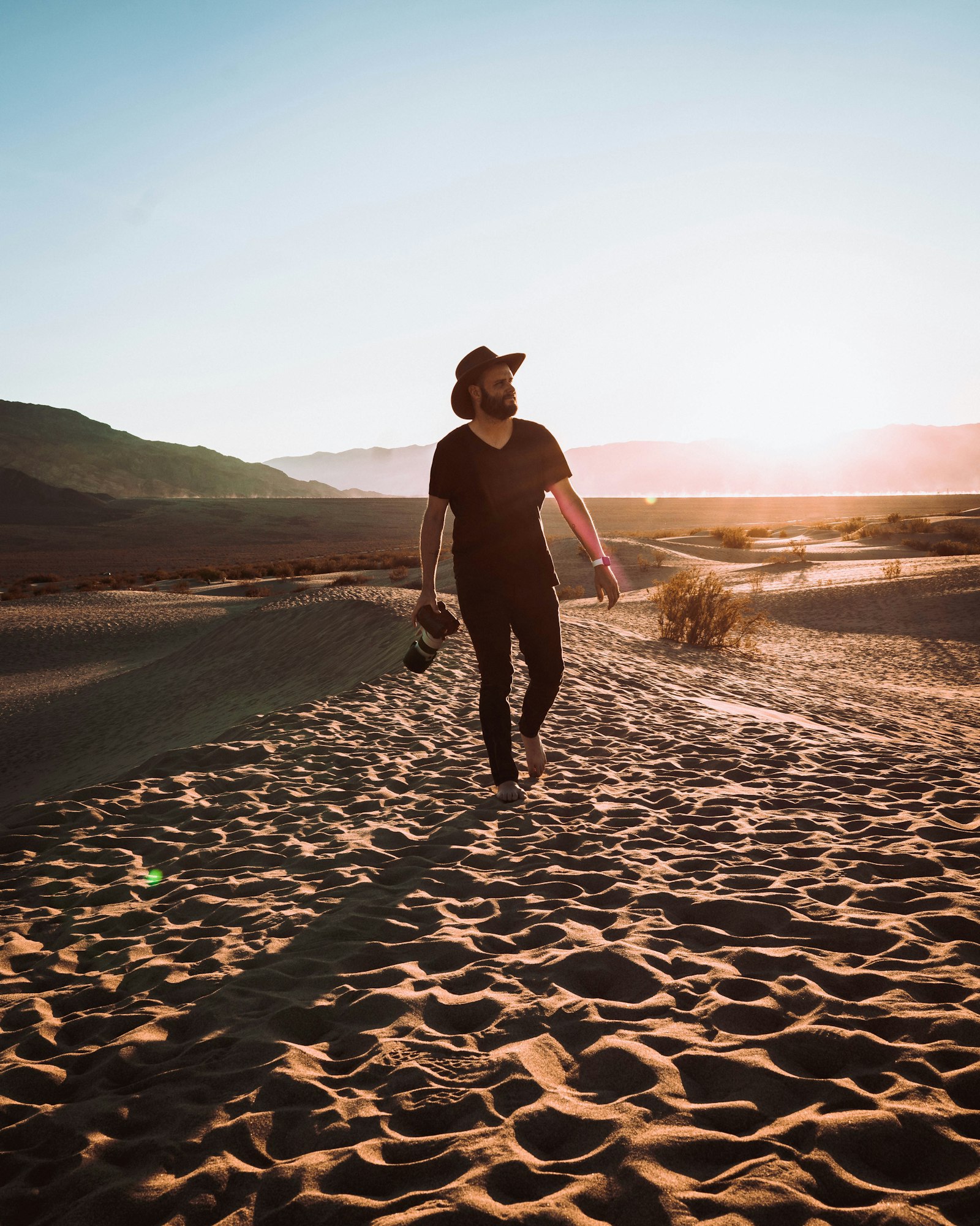 Sony a7R III sample photo. Man walking on sand photography