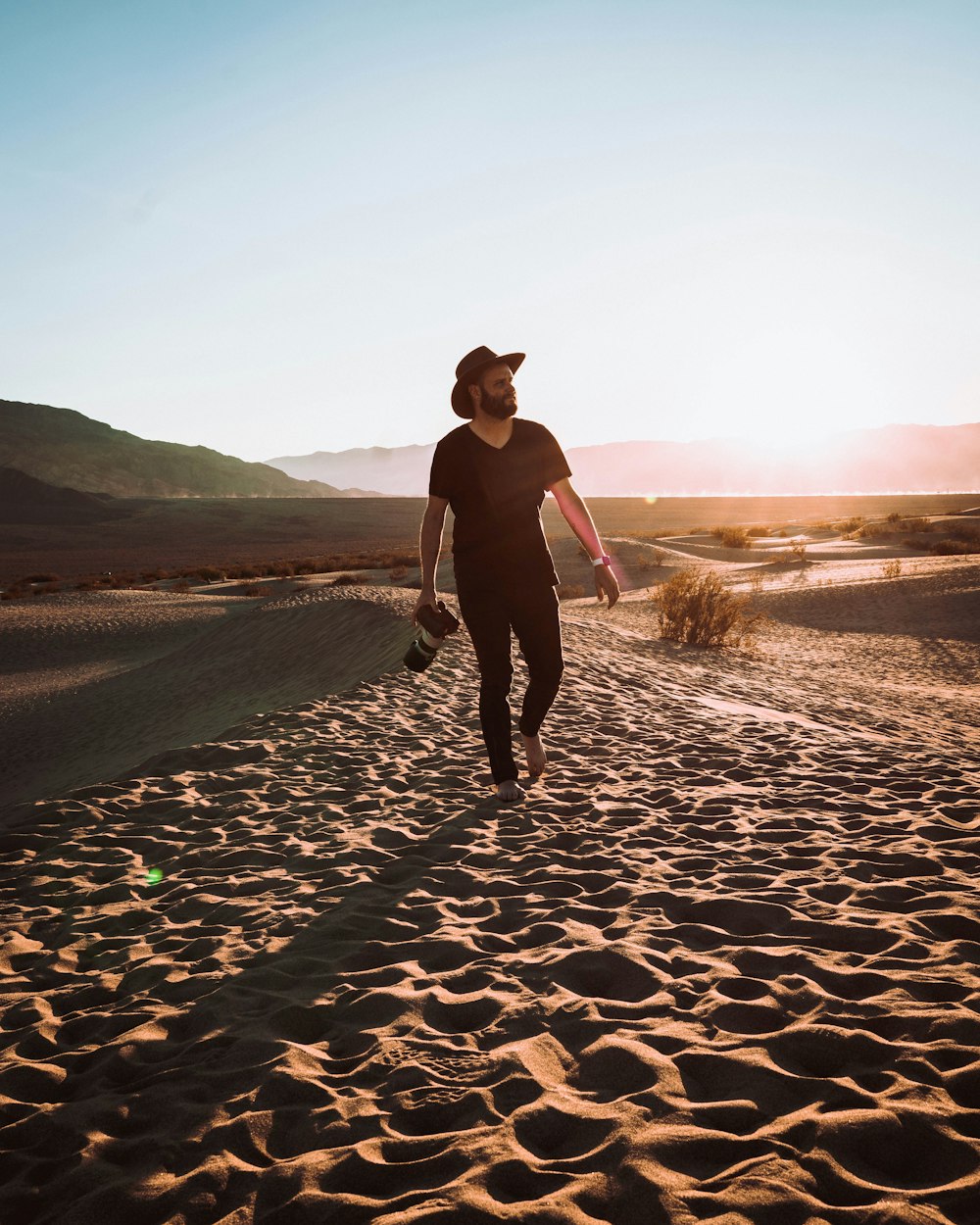 man walking on sand