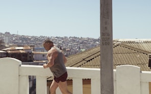 man wearing gray tank top