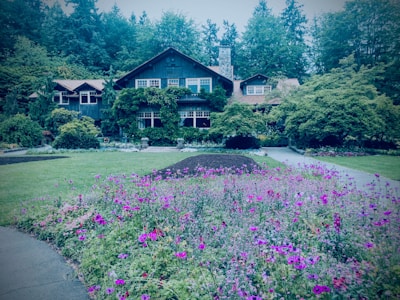 Cozy townhouse exterior surrounded by greenery and a small garden.