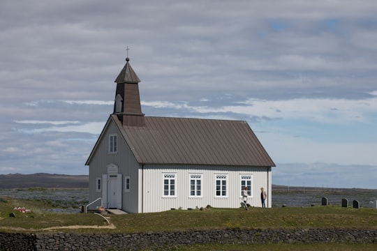 whtie and brown cathedral in Strandarkirkja Iceland