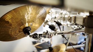 Drum kit details highlighting cymbals and snare with subtle reflections in blue and gray.