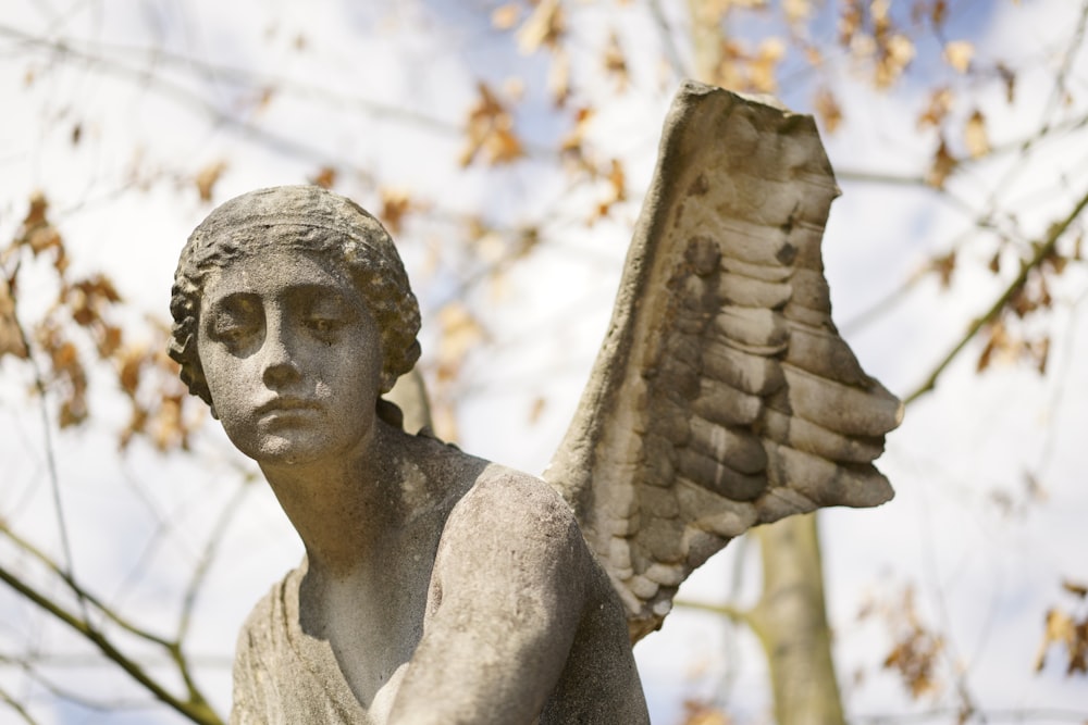 statue of person with wings